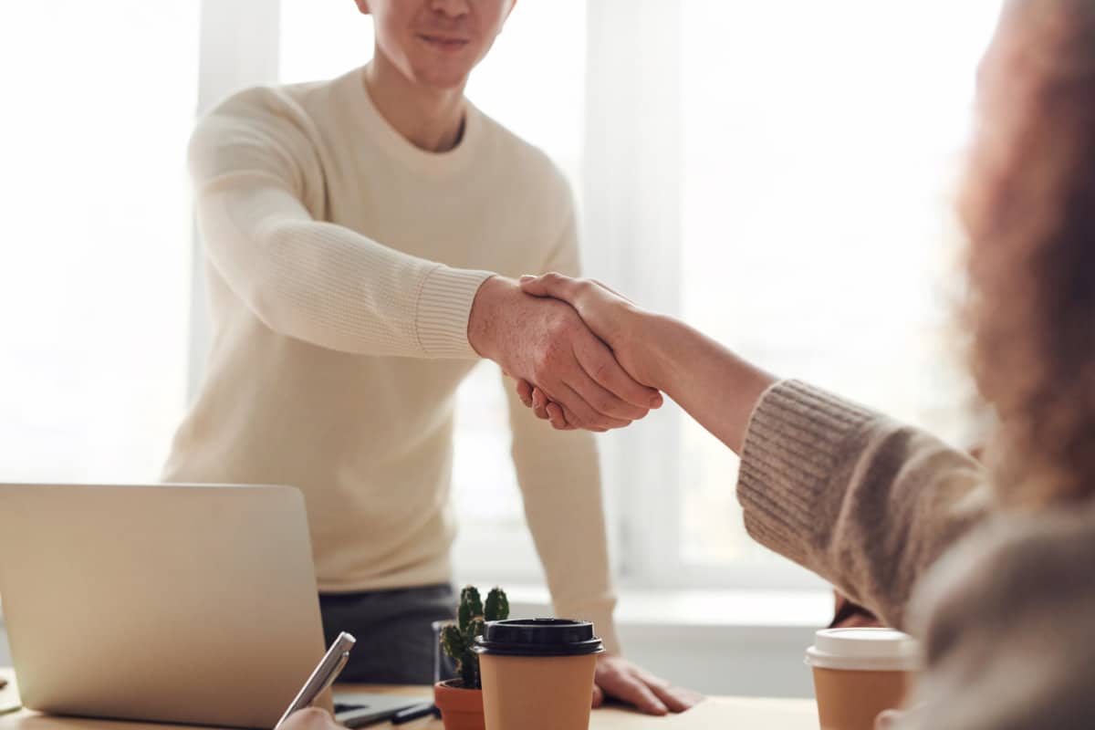 Man and woman shaking hands to make a deal on a business partnership with Efreightship